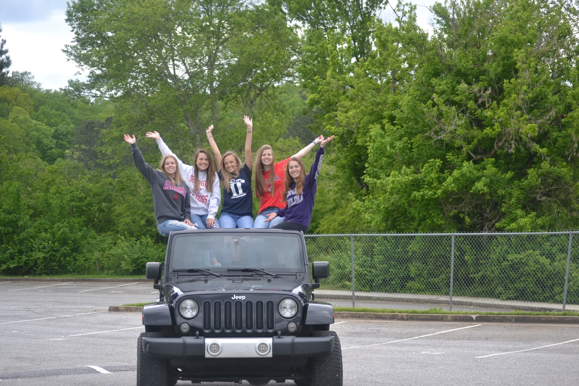 Bree and her friends celebrating together on a Jeep
